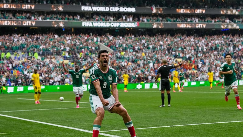 Mexico's Raul Jimenez celebrates after scoring his side's second goal during the World Cup...