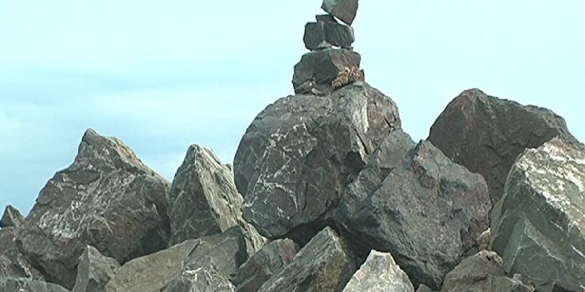 Why do people stack rocks along Lake Superior?