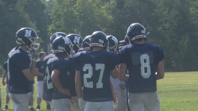 The Knights in a huddle during the pre-season scrimmage at North Central high school