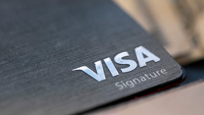 This Aug. 11, 2019, file photo shows a Visa logo on a credit card in New Orleans. Payment...