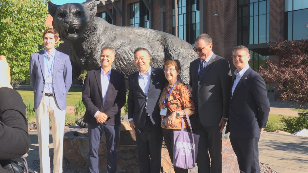 The Governor of Shiga (middle) takes a photo with NMU and Marquette City Partnership...