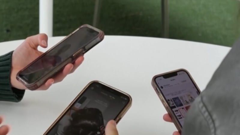 Group of kids on social media on their cell phones